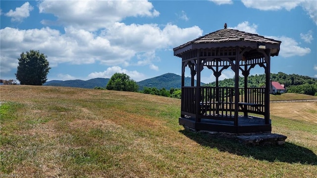 view of yard with a mountain view and a gazebo