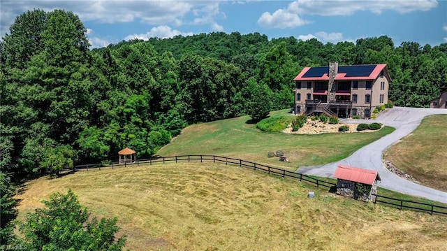 birds eye view of property with a rural view