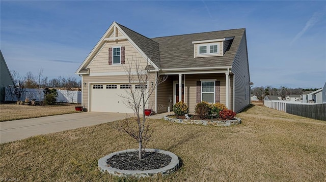 craftsman house featuring fence, driveway, roof with shingles, a front lawn, and a garage