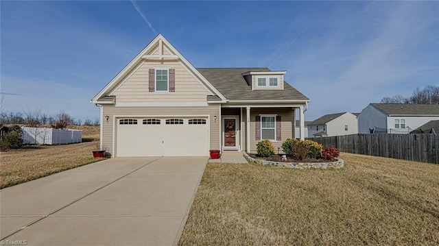 craftsman-style home with fence, driveway, an attached garage, covered porch, and a front lawn