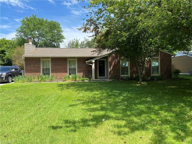 ranch-style home featuring a front yard