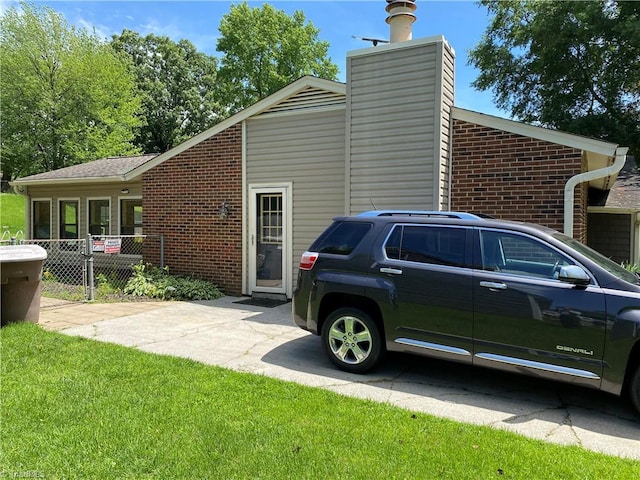 view of home's exterior featuring a yard