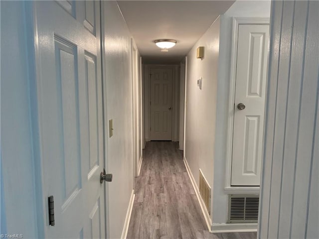 hallway featuring light hardwood / wood-style flooring