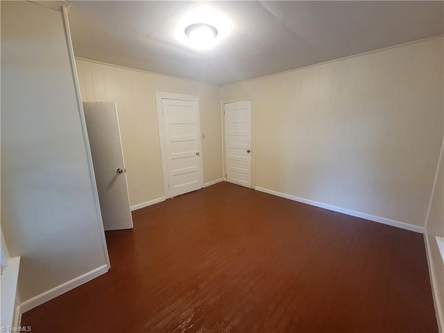 unfurnished room featuring dark hardwood / wood-style floors