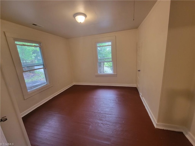 empty room featuring dark hardwood / wood-style floors