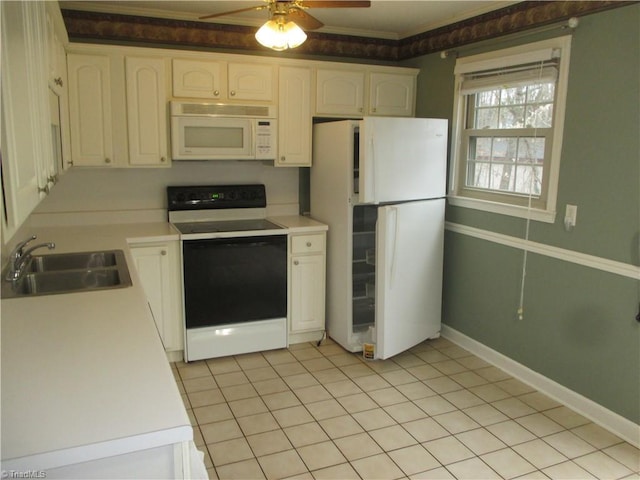 kitchen with white appliances, white cabinets, sink, ceiling fan, and light tile patterned flooring