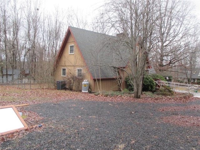 view of side of property with central AC