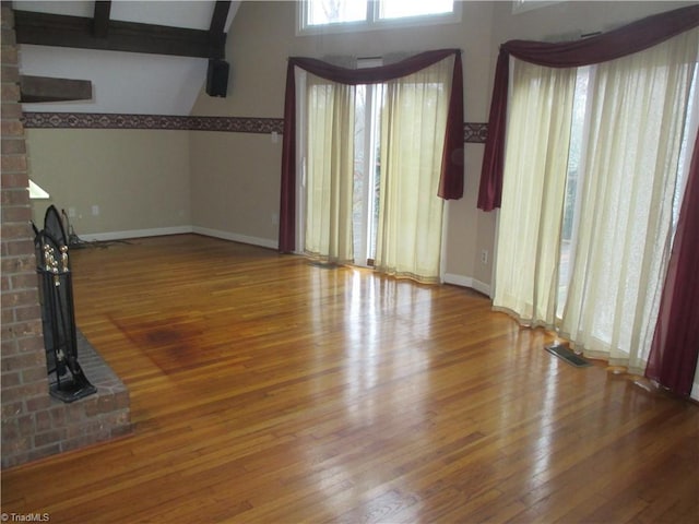 unfurnished living room with hardwood / wood-style flooring