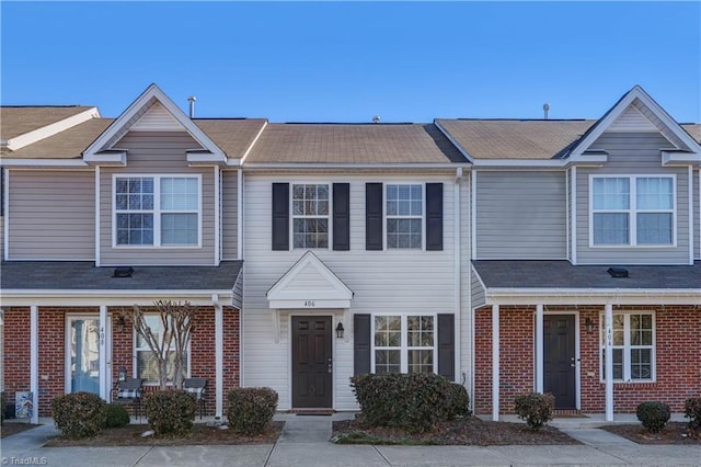 view of property with brick siding