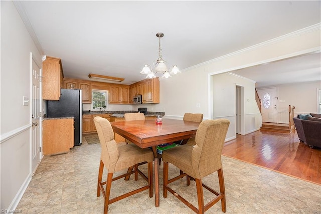 1329 Chickadee Cir, Asheboro, NC 27203 - dining room featuring a chandelier, baseboards, and crown molding