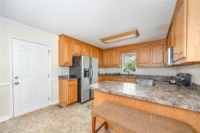 1329 Chickadee Cir, Asheboro, NC 27203 - kitchen featuring stainless steel appliances, a peninsula, a sink, ornamental molding, and dark countertops