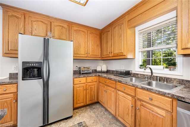 1329 Chickadee Cir, Asheboro, NC 27203 - kitchen with appliances with stainless steel finishes, a sink, dark countertops, and brown cabinetry