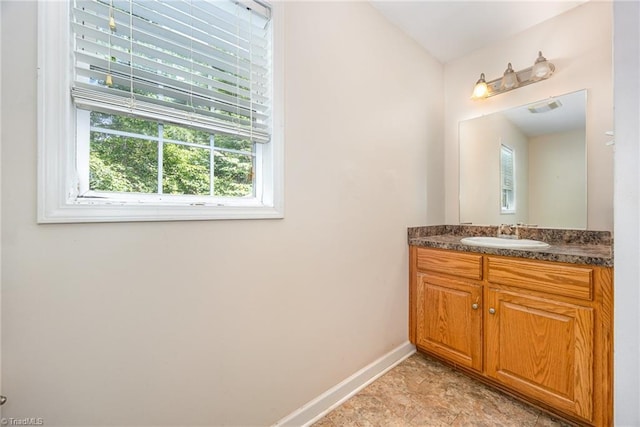 1329 Chickadee Cir, Asheboro, NC 27203 - bathroom featuring healthy amount of natural light, vanity, and baseboards