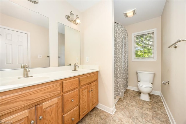 1329 Chickadee Cir, Asheboro, NC 27203 - bathroom with toilet, double vanity, baseboards, and a shower with shower curtain