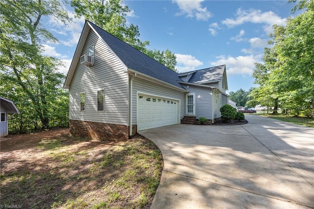 1329 Chickadee Cir, Asheboro, NC 27203 - view of property exterior with concrete driveway, an attached garage, a shingled roof, and cooling unit