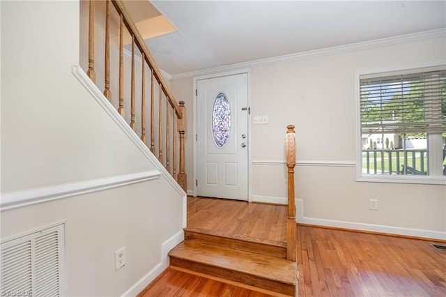 1329 Chickadee Cir, Asheboro, NC 27203 - foyer entrance featuring stairs, hardwood / wood-style floors, crown molding, and baseboards
