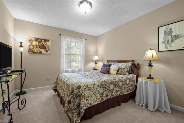 3100 Coachmans Way, Durham, NC 27705 - bedroom with baseboards, a textured ceiling, and light colored carpet