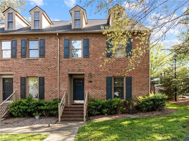 3100 Coachmans Way, Durham, NC 27705 - view of front of property with a chimney, brick siding, and a front yard