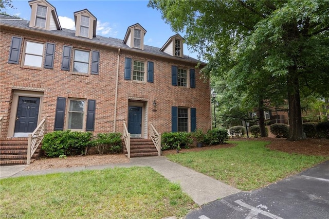 3100 Coachmans Way, Durham, NC 27705 - view of front of property featuring entry steps, a front yard, and brick siding
