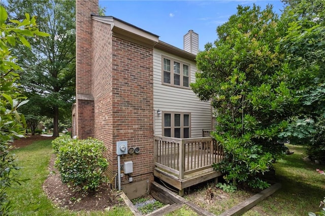 3100 Coachmans Way, Durham, NC 27705 - back of property with a chimney, a wooden deck, and brick siding