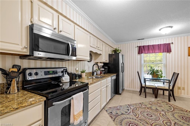 3100 Coachmans Way, Durham, NC 27705 - kitchen with a sink, a textured ceiling, wallpapered walls, appliances with stainless steel finishes, and ornamental molding