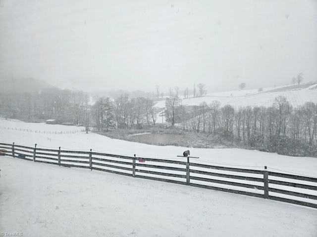 4793 Cheek Mountain Rd, Laurel Springs, NC 28644 - yard layered in snow with fence