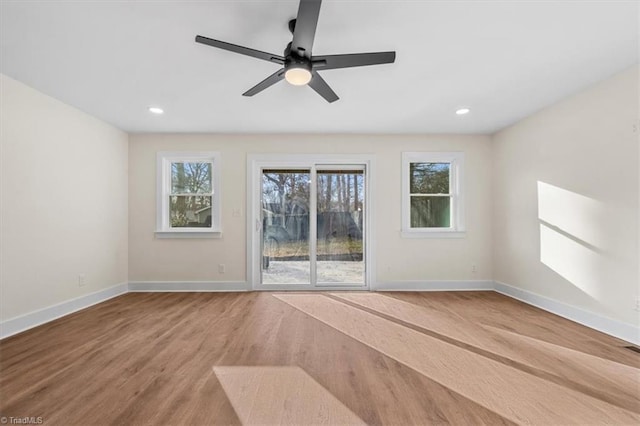 spare room with ceiling fan and wood-type flooring