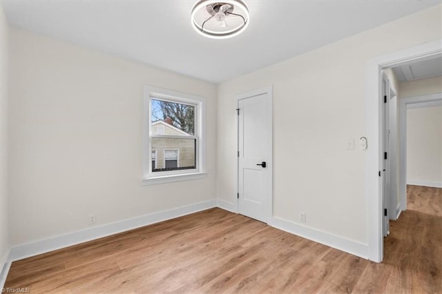 spare room with light hardwood / wood-style floors