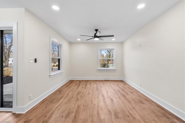 unfurnished room featuring ceiling fan and light hardwood / wood-style flooring