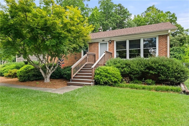 2505 Roland Rd, Greensboro, NC 27407 - view of front of property featuring a front lawn and brick siding