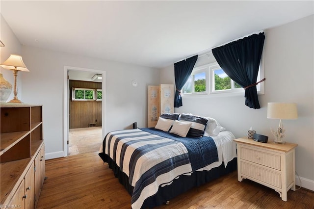 2505 Roland Rd, Greensboro, NC 27407 - bedroom with multiple windows and light wood-style floors