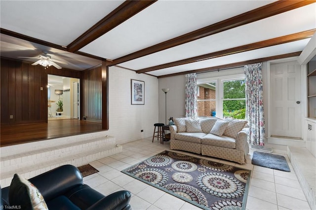 2505 Roland Rd, Greensboro, NC 27407 - tiled living room with beamed ceiling, a ceiling fan, and wood walls