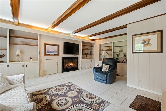 2505 Roland Rd, Greensboro, NC 27407 - living area with light tile patterned flooring, beamed ceiling, built in features, and a fireplace