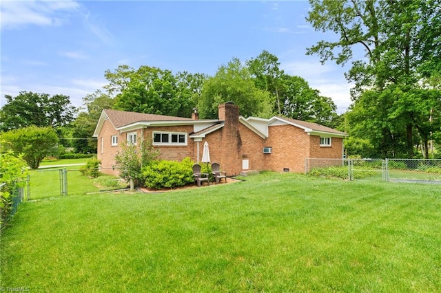 2505 Roland Rd, Greensboro, NC 27407 - rear view of house featuring a gate, a chimney, a fenced backyard, and brick siding