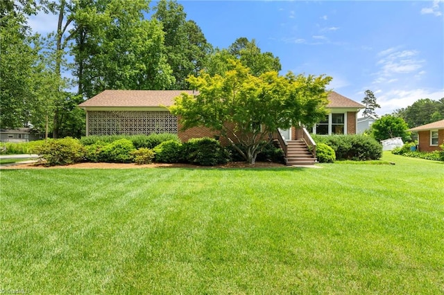 2505 Roland Rd, Greensboro, NC 27407 - view of front of house featuring a front lawn and brick siding
