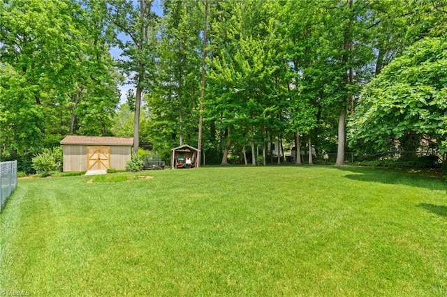 2505 Roland Rd, Greensboro, NC 27407 - view of yard with a shed and view of wooded area