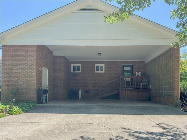 2505 Roland Rd, Greensboro, NC 27407 - view of front facade featuring concrete driveway, an attached carport, and brick siding