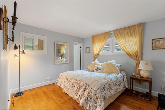 2505 Roland Rd, Greensboro, NC 27407 - bedroom featuring baseboards and wood finished floors
