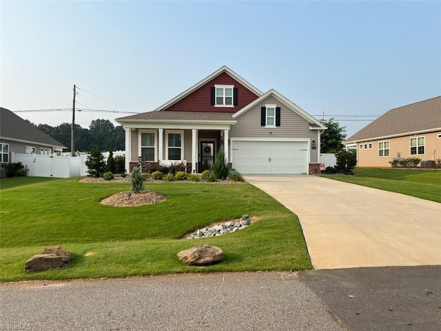 craftsman-style house featuring a garage, a porch, and a front lawn