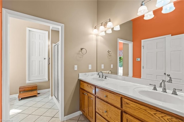 bathroom featuring vanity, tile patterned floors, and an enclosed shower