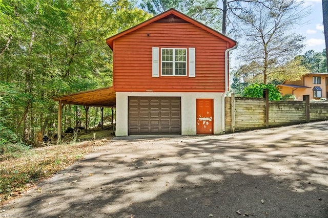 view of side of home with a garage