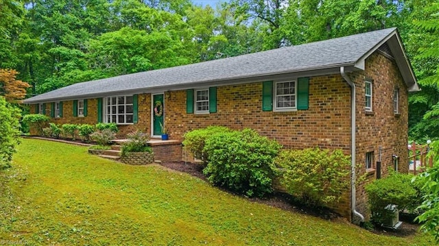 4515 Gilmore Dr, Liberty, NC 27298 - single story home featuring a front lawn and brick siding