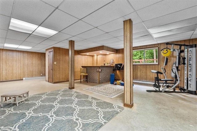 4515 Gilmore Dr, Liberty, NC 27298 - below grade area featuring wood walls, a paneled ceiling, a baseboard radiator, bar area, and baseboards