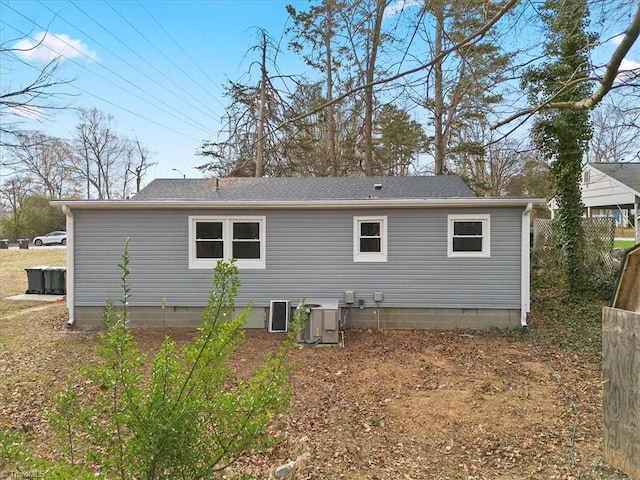 rear view of house with central air condition unit