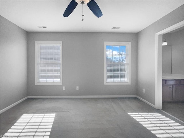 empty room with carpet and ceiling fan