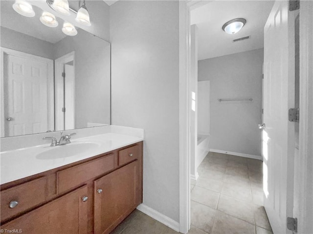 bathroom with vanity, tile patterned floors, and an inviting chandelier