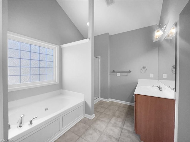 bathroom with vanity, lofted ceiling, tile patterned floors, and separate shower and tub