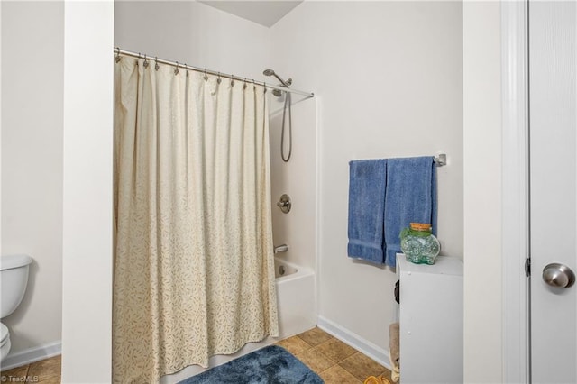 bathroom featuring shower / bath combo, toilet, and tile patterned floors