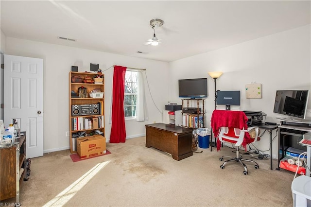 carpeted office with ceiling fan