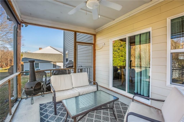 sunroom / solarium with ceiling fan